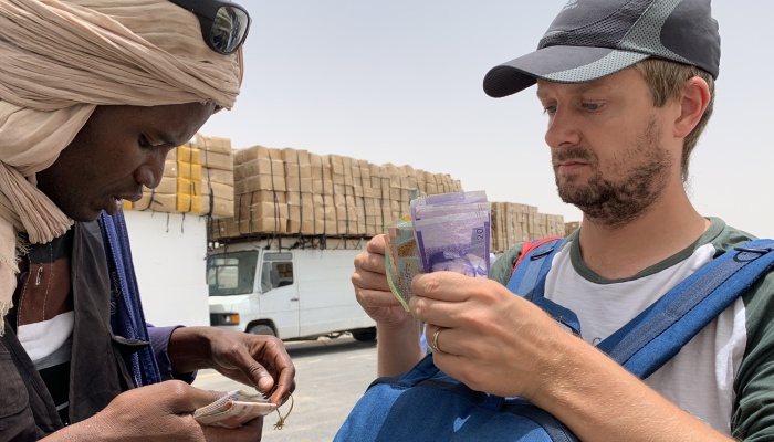 Martin exchanging money. Crossing Borders Dakhla to Mauritania. While In Africa